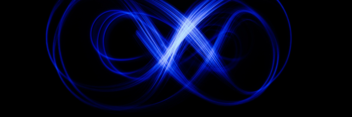 Image of vibrant blue swirls on a black background