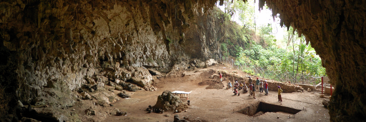 Photo of people in a large cave 