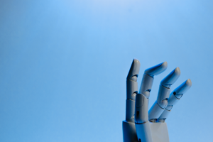 A robot hand reaching towards the light